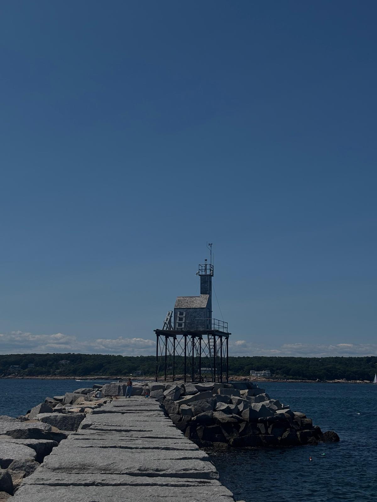 Lighthouse on rocky pier