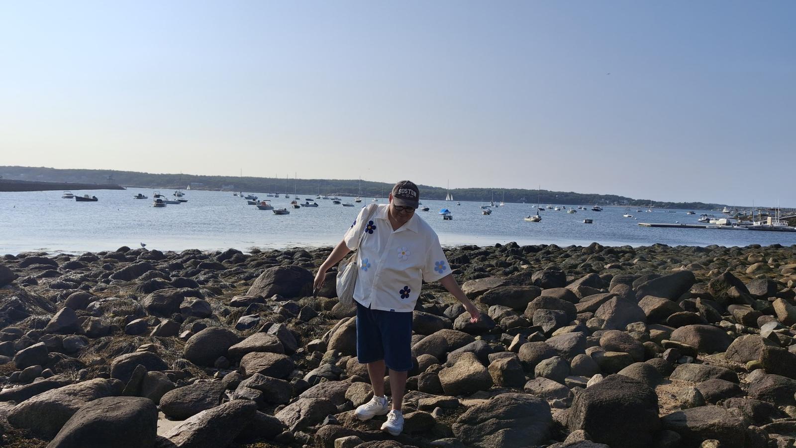 Diego on rocky New England shore